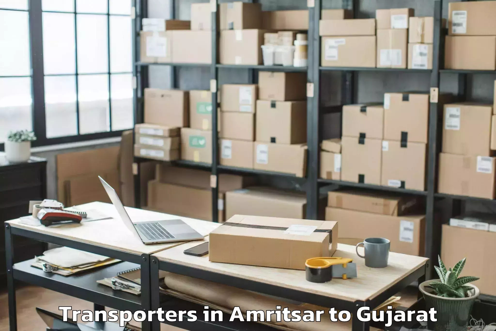 Top Amritsar to Gujarat Ayurved University Jam Transporters Available